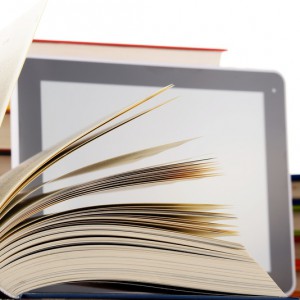 Composition with books and tablet computer isolated on white background